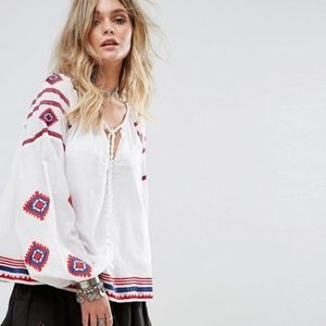 Tularosa white red and blue embroidered blouse.